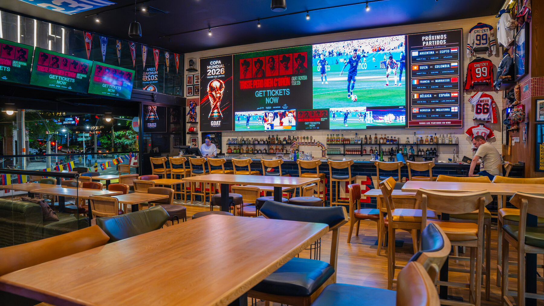 GOAT Sports Bar Medellín interior with its large sports viewing screen